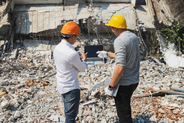 istock Demolition control supervisor and contractor discussing on demolish building. 1406026971