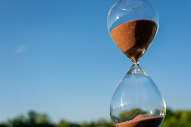 istock Hourglass against the blue sky 1406027923