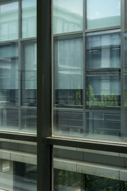 istock Building reflected in glass curtain wall 1406028458