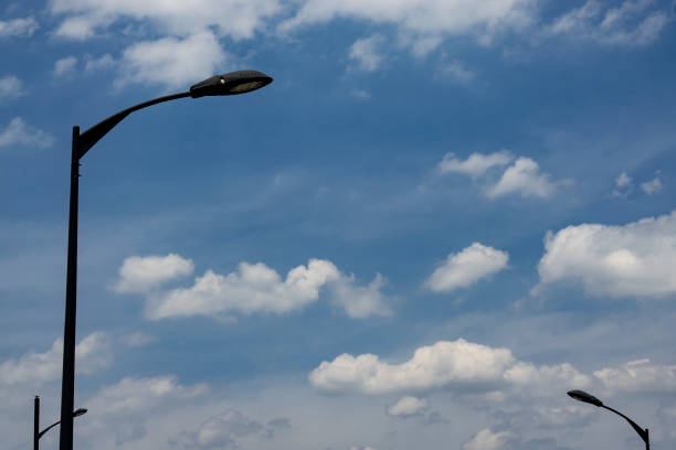 Street lights under blue sky and white clouds