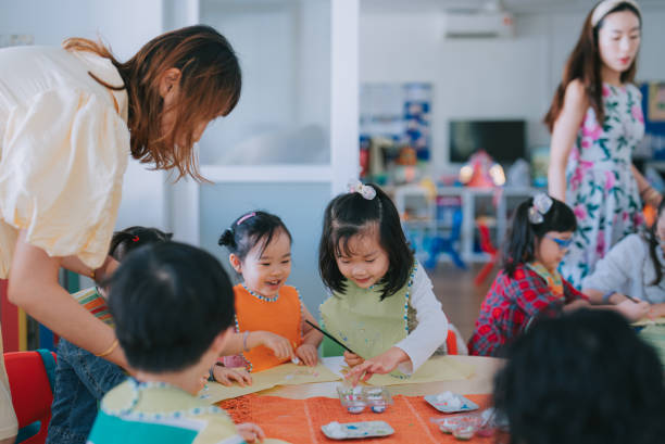istock asian Montessori preschool student enjoying drawing in classroom 1406029210