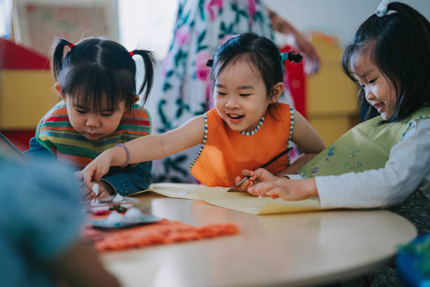 istock asian Montessori preschool student enjoying drawing in classroom 1406029213