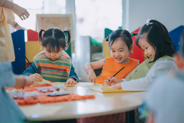 istock asian Montessori preschool student enjoying drawing in classroom 1406029221