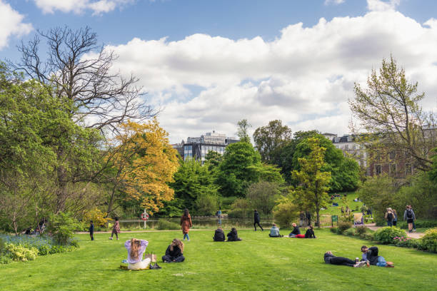 Copenhagen, Denmark - People making the most of sunny springtime weather in the tranquility of Copenhagen's Botanical Gardens.