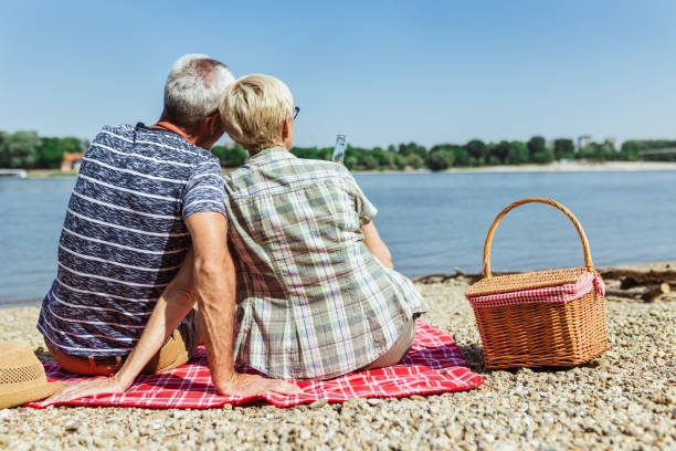 istock Senior couple enjoying picnic time on the riverside. 1406031298