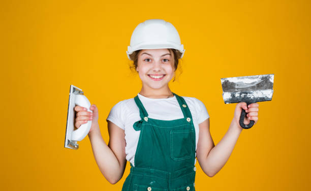 istock Welcome to my world. future engineer. happy kid use spatula repairing tool. building construction site. child architect worker. labor day concept. childhood development. teenager girl assistant 1406032466