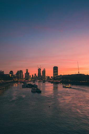 London cityscape and Thames River at sunset, London England UK