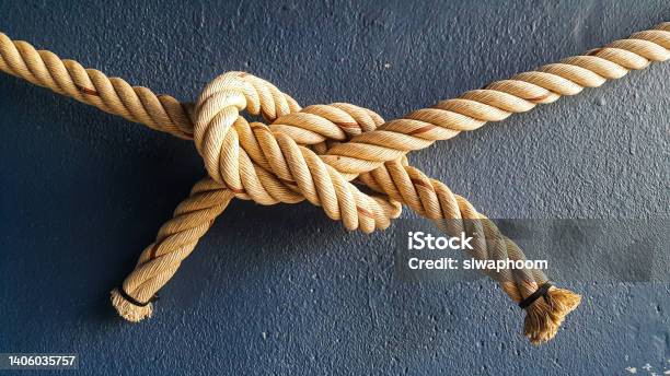 Tying Ropes In A Correlation Pattern Stock Photo - Download Image Now - Tying, Tied Knot, Rope