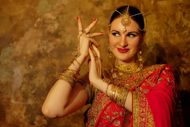 istock Beautiful indian woman dancer in red sari. 1406038252