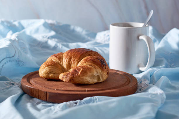 istock Yummy freshly croissant, sliced almonds, with chocolate filling 1406039037