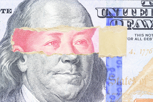 Trade tension or trade war between US and China, two nation conflict, world financial concept : Banknotes of USA and China yuan with a paper peel that reveals a portrait of Mao Zedong and US president