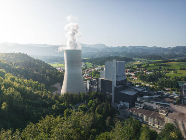 istock Cooling tower emitting gases from a coal powered thermal power station 1406045508