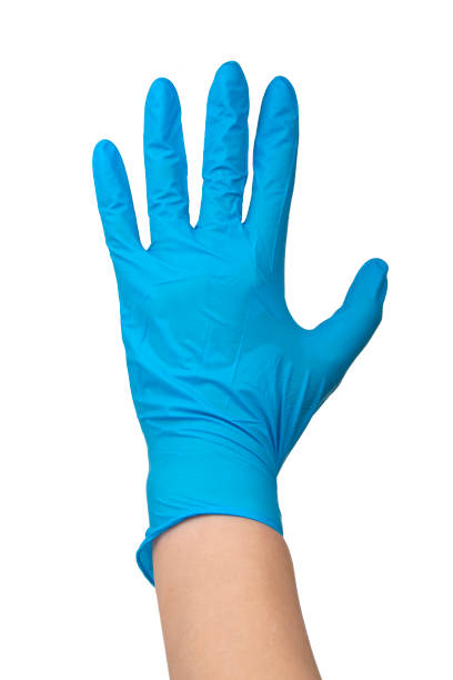 istock Blue nitrile medical gloves on hands isolated on the white 1406046161