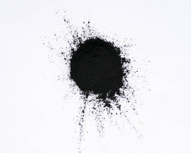 istock Black bamboo activated charcoal powder isolated on white background 1406048797