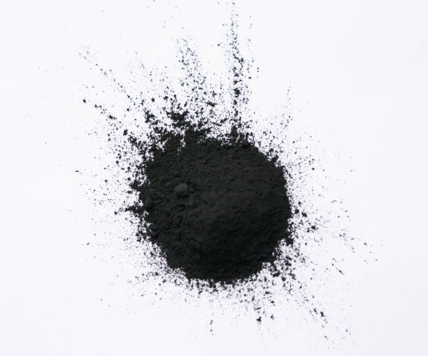istock Black bamboo activated charcoal powder isolated on white background 1406048801