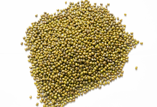 Mung beans or Green moong dal isolated on white background