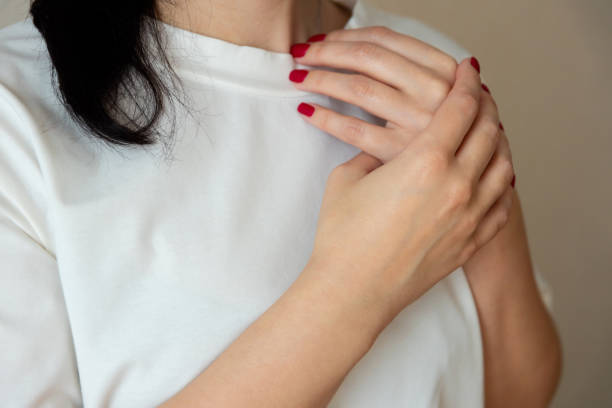 istock pain in the arm. Womens hands 1406050305