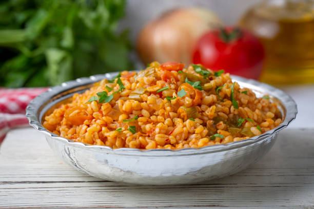 Traditional turkish bulgur pilaf with tomato sause in plate (Turkish name; meyhane pilavi) Traditional turkish bulgur pilaf with tomato sause in plate (Turkish name; meyhane pilavi) bulgur wheat stock pictures, royalty-free photos & images