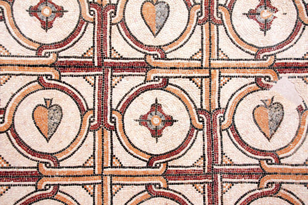Real ancient roman mosaic flower hearts and lines pattern for background. Golf Roses , Spain