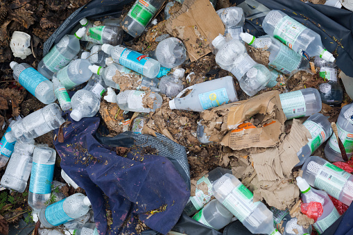 Wild garbage with full saline solution bottles thrown away in Bangkok