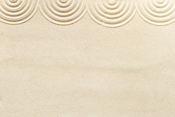 istock Circle lines on sand, beautiful sandy texture. Natural sand background for spa wellness, concept for relaxation balance and harmony. Concentration and spirituality in Japanese zen garden 1406059968