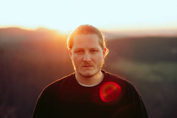 istock Cool Looking Young Man Outdoors at Sunset Millennial Generation Summer Portrait 1406060787