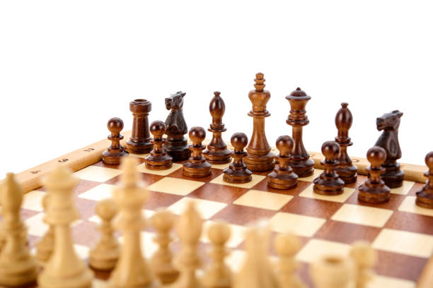 istock Classic Wooden chess pieces on chessboard 1406062135
