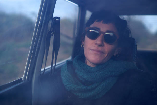 istock beautiful Latina woman inside the car 1406062182
