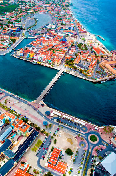 AERIAL: Curacao 2009 2 August 2009: An aerial view of the Caribbean town of Willemstad, on the island of Curacao, in the Netherlands Antilles. Curaçao is known for tourism, scuba diving, and technologically advanced business districts. Mandatory Photo Credit: Ed Wolfstein Photo willemstad stock pictures, royalty-free photos & images