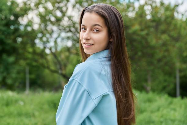 outdoor portrait of a beautiful teenage girl 15 years old - 13 14 years teenager school education imagens e fotografias de stock