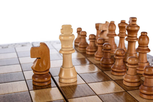 Beige Brown Wooden chess different pieces figures standing on chessboard. Closeup game concept competition, Classic Tournament.