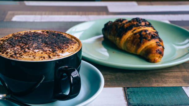 istock Cappuccino with Croissant 1406065316