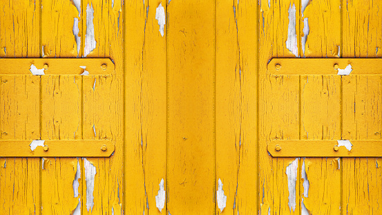 old abstract yellow colorful painted exfoliate peeled off rustic wooden boards, wooden gate, wooden door texture - wood wall background shabby