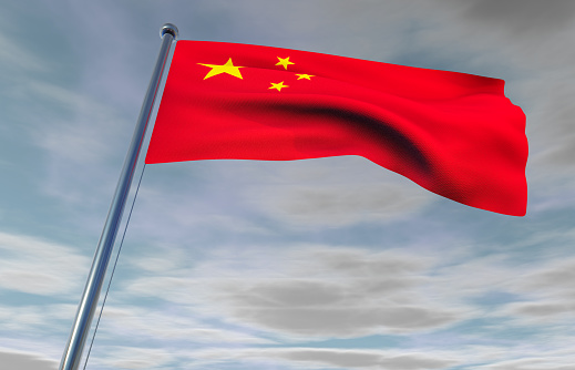 China Flag on a Cloudy Sky