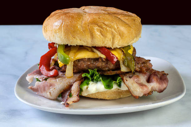 istock bacon cheese burger  top with onions and peppers 1406068401