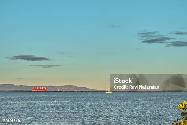 Grain Ships And Small Vessels Glow Int He Evening Sun Thunder Bay Marina Ontario Canada Stock Photo - Download Image Now