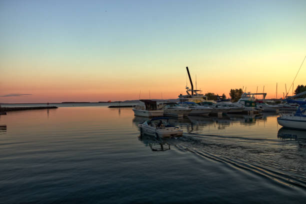 istock Sundown turns the horizon orange - Thunder Bay Marina, Ontario, Canada 1406069063