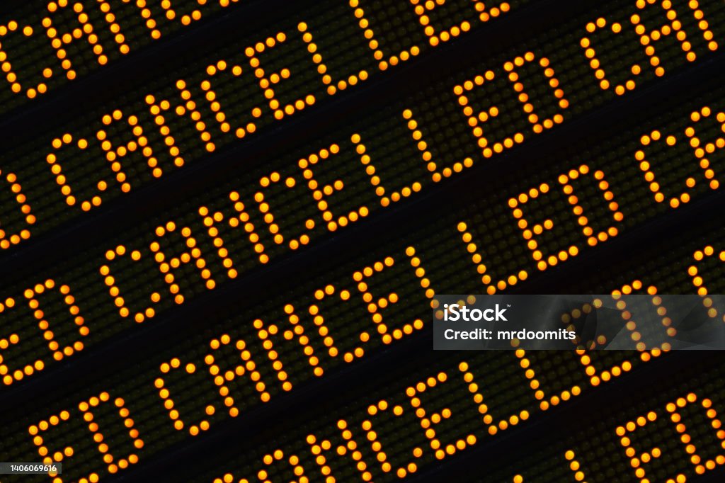Cancelled Sign Closeup A Close Up Of The Word Cancelled Repeated Multiple Times On A Sign At A Station Or Airport Strike - Protest Action Stock Photo
