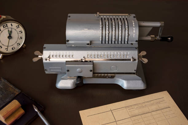 An old mechanical calculator on an old office desk. Accounting.