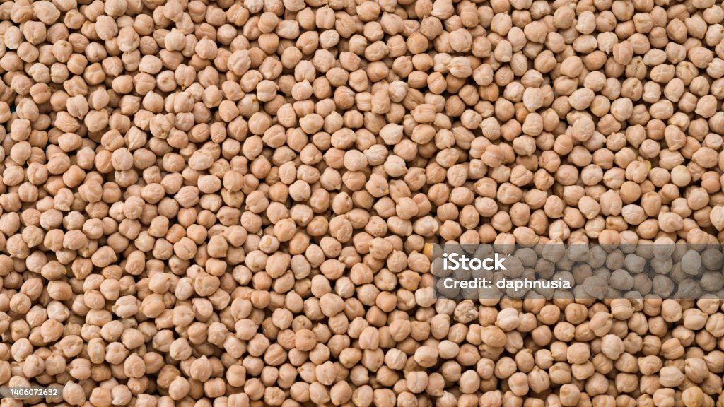 aw chickpeas close-up Food background from a texture of raw chickpeas close-up.  Dried organic chickpeas top view.  Vegan healthy diet concept Agriculture Stock Photo