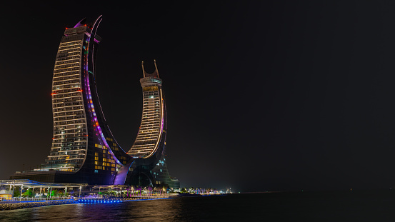 Lusail, Qatar- June 06, 2022: The crescent tower in the newly developing city lusail in Qatar.