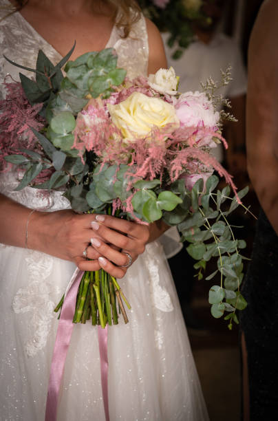 istock Married bride holding rose flower bouquet. Wedding engagement ceremony 1406074761