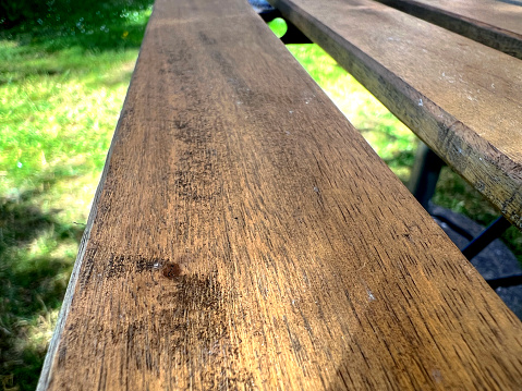 The old wooden beams of a table in the garden.