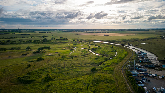 Aerial view of the golf course, Felixstowe countryside and a mud creek tributary of the River Deben.