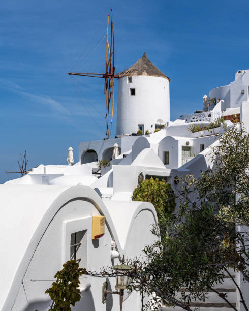 istock Iconic white windmill at Oia village, Santorini, Greece 1406083398