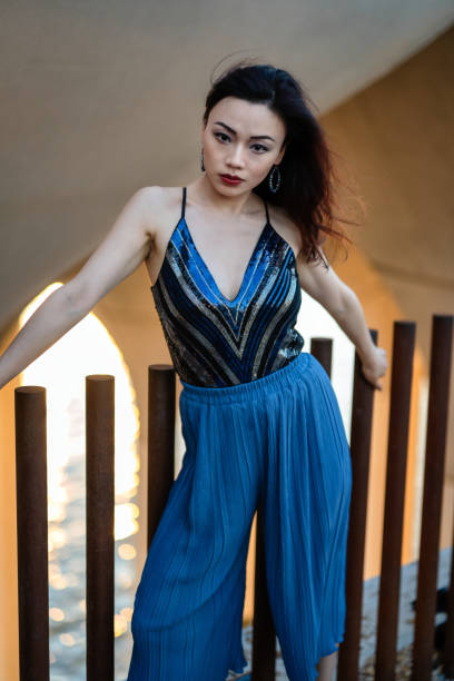 istock Beautiful Woman At Sunset 1406088173