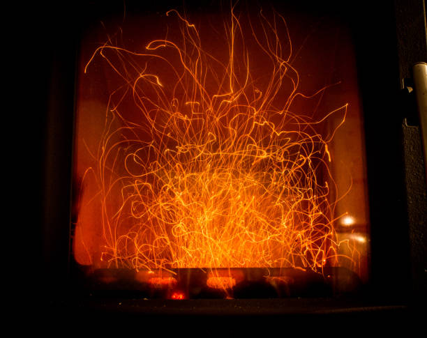 The long exposure shows how sparks fly from the firewood through the fireplace.