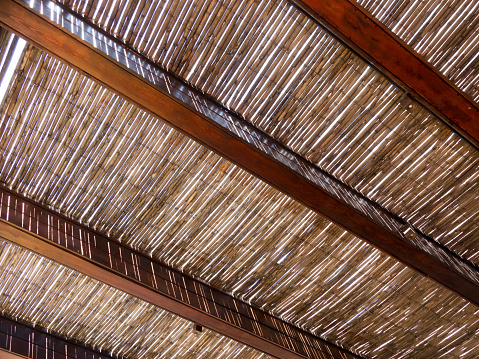Canopy with wooden roof.A canopy of reeds.