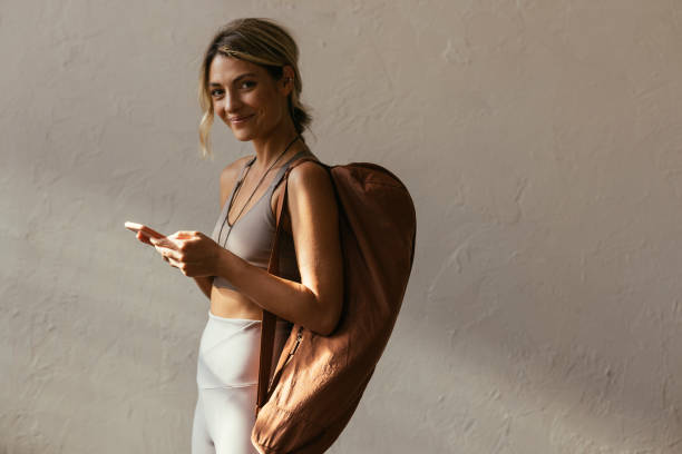 istock Blonde Woman Texting On Her Smartphone 1406094915