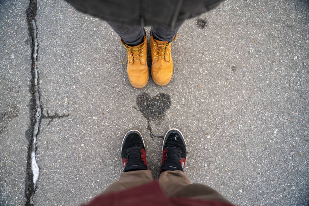 istock Two people standing on the heart sign on the path 1406095701
